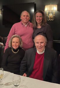 Two people are sitting at a table, from left are Nicki and Tommy Lamar. Behind them are their children, from left, Todd Lamar and his sister, Mindi.