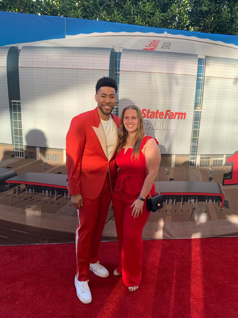 Avery Urquhart with "Jake from State Farm" at a pre-Super Bowl event. 